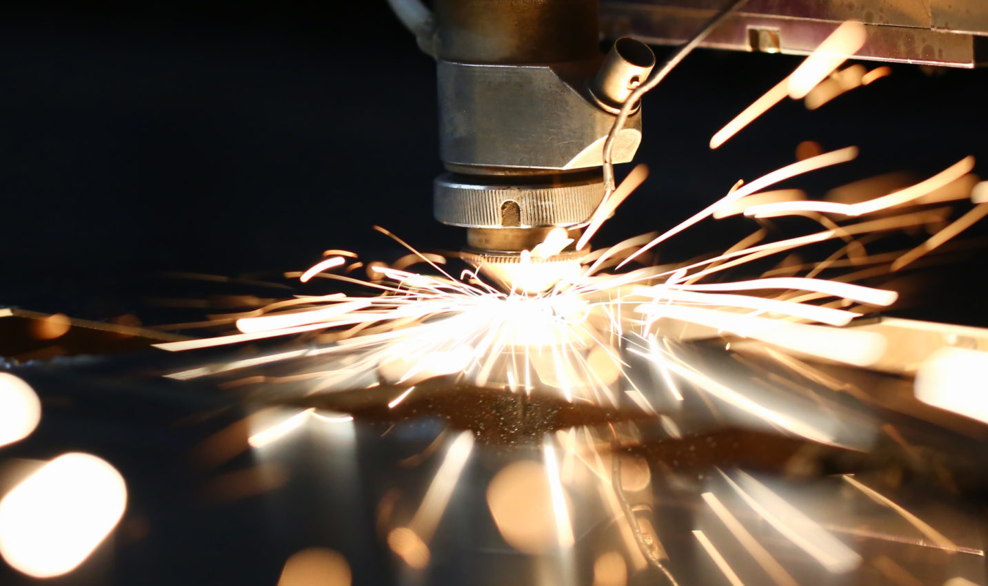 Sparks fly out machine head for metal processing